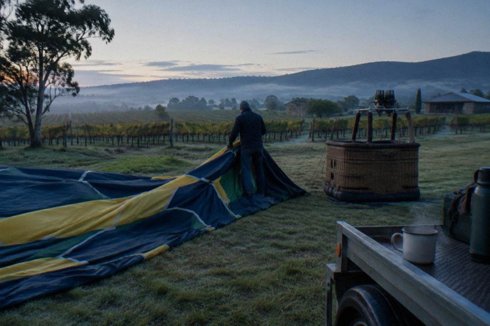 Calm misty morning over Hunter Valley farmland and vine rows