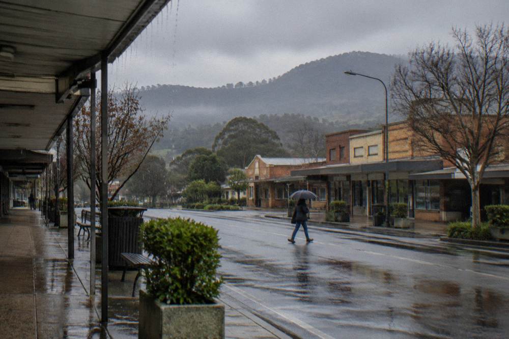 Country town main street with shops and hills in the distance